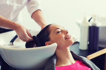 Wall Mural - happy young woman at hair salon