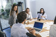 © juripozzi - Young team of coworkers doing a meeting in a modern studio
