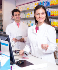 Wall Mural - Pharmacist at reception of drugstore.