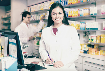 Wall Mural - pharmacist standing at pay desk