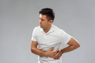 Wall Mural - unhappy man suffering from stomach ache