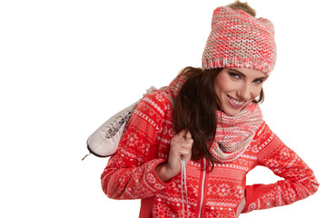 Pretty woman ice skating winter sport activity in white cap smil