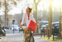 Young Woman Riding Bicycle In Paris