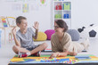 © Photographee.eu - Babysitter playing with boy