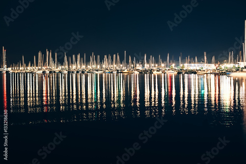 Fotografie, Obraz Yachts and boats in marina of La Spezia at night with reflection