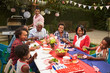 © Monkey Business - Multi generation black family at table for 4th July barbecue