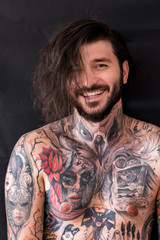 Wall Mural - Tattooed naked man with messy wet hair laughing