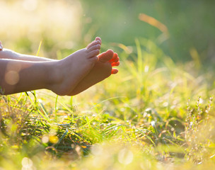  children lying on grass