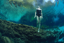 Female Diver In River Water 