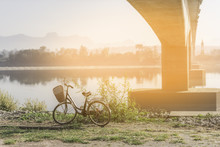 Bicycle And Morning Mist Bridge.