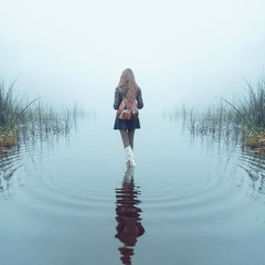 girl in the fog in the lake