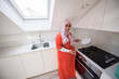 © Jasmin Merdan - Muslim traditional clothing woman in white modern kitchen