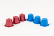 © marcorubino - Modern unbranded colorful capsules for espresso coffee machine