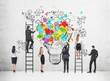 © ImageFlow - Rear view of a business people standing on ladders and floor near a concrete wall and drawing a colorful creative business idea sketch and a light bulb