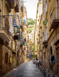 Narrow street in old town of Naples city in Italy