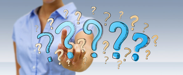 Fototapete - Businesswoman touching hand drawn question marks with her finger