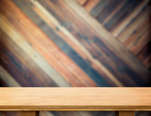 modern wooden table top at blurred diagonal wood plank wall,Temp