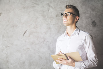 Wall Mural - Attractive male with notepad