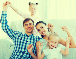 Wall Mural - Cheerful parents with two daughters