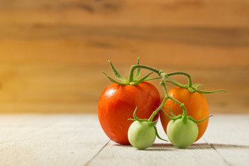 fresh tomato on wooden background.