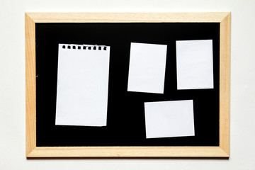 Wall Mural - Note paper in black board with wood frame on white background