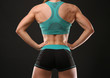 © Africa Studio - Young athletic woman on black background