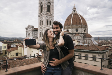 Young couple in love visiting the city of Florence in Italy