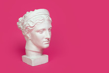 Marble Head Of Young Woman, Ancient Greek Goddess Bust Isolated On Pink Background With Space For Text.