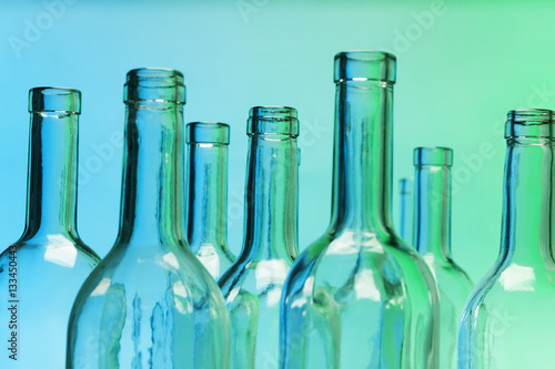 Fotografia, Obraz Empty glass bottles with close-up focus to necks