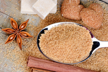 Wall Mural - Anise star with cinnamon and sugar on table