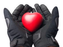 Isolate Hands Wear Motorbike Gloves And Hold The Red Heart ,In Concept Biker In Love Valentines Day