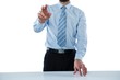 © WavebreakMediaMicro - Businessman touching an invisible screen