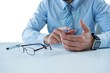 © WavebreakMediaMicro - Businessman sitting at table touching a glass sheet
