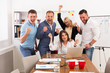 © Prostock-studio - Happy business people team celebrate success in the office