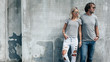 © Alena Ozerova - Couple in gray t-shirt over street wall