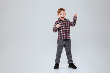 Wall Mural - Full length image of funny young boy