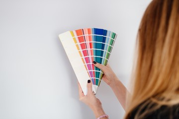 Woman designer or architect choosing wall color