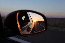 Sunset in a rear view mirror