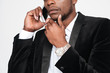© Drobot Dean - Cropped photo of handsome african businessman talking by his phone