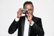 © Drobot Dean - Handsome young african businessman make photo by camera
