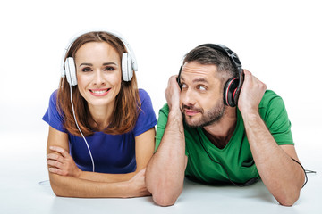 Wall Mural - Couple in headphones listening to music