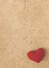 Blurred Vintage Valentine Concept Background, Red Heart On Natural Texture Paper Background