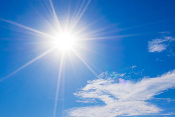 Wall Mural - blue sky with clouds and sun reflection.the sun shines bright in