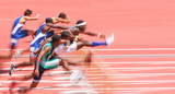 Fototapeta  - Jumping over hurdles, motion blur