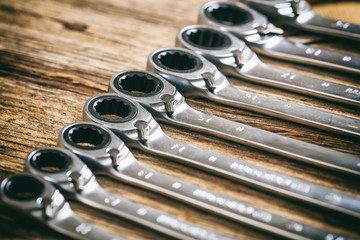 Wall Mural - Set of wrenches on wooden background