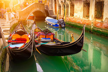 Canal With Two Gondolas In Venice, Italy