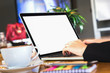 © sitthiphong - woman hand working laptop on wooden desk in office