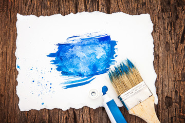 Art brush and blue watercolor painted with white paper art  