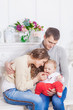 © lobodaphoto - Modern Christmas Family Portrait In Home Holiday Living Room