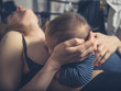 Little baby breastfeeding in bed
